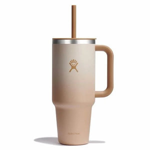 Tall ombre beige mug with handle and straw.