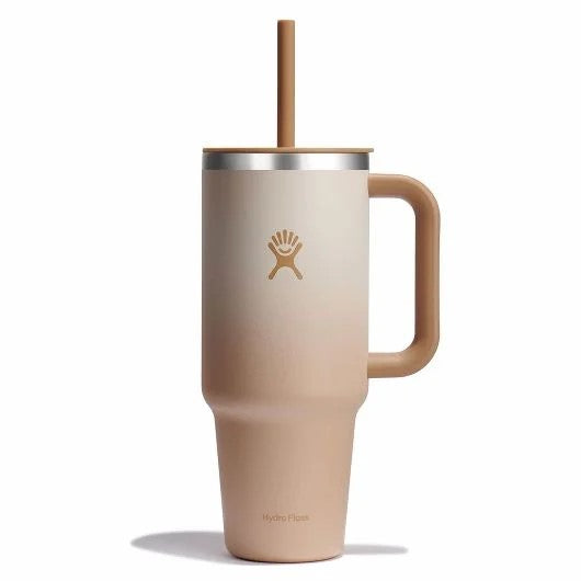 Tall ombre beige mug with handle and straw.