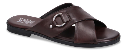 A brown leather sandal with crossed straps and a silver ring detail.