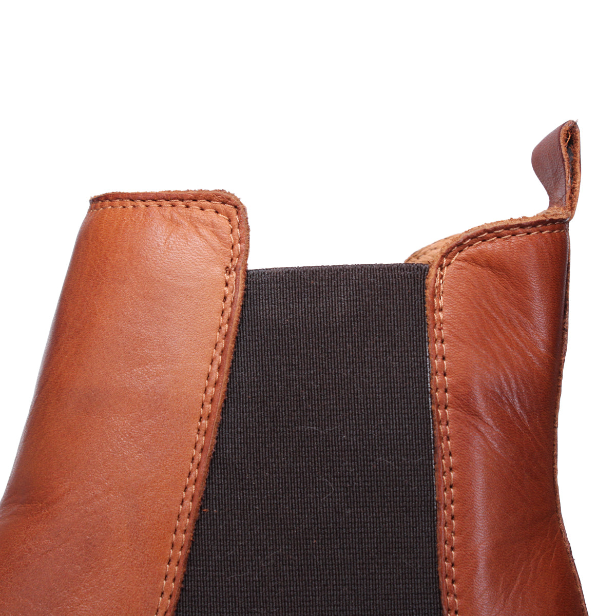 Close up view of a tan leather boot showing the pull tab.