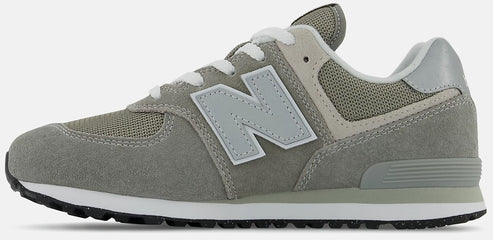 a gray and white athletic shoe with a large 'N' logo