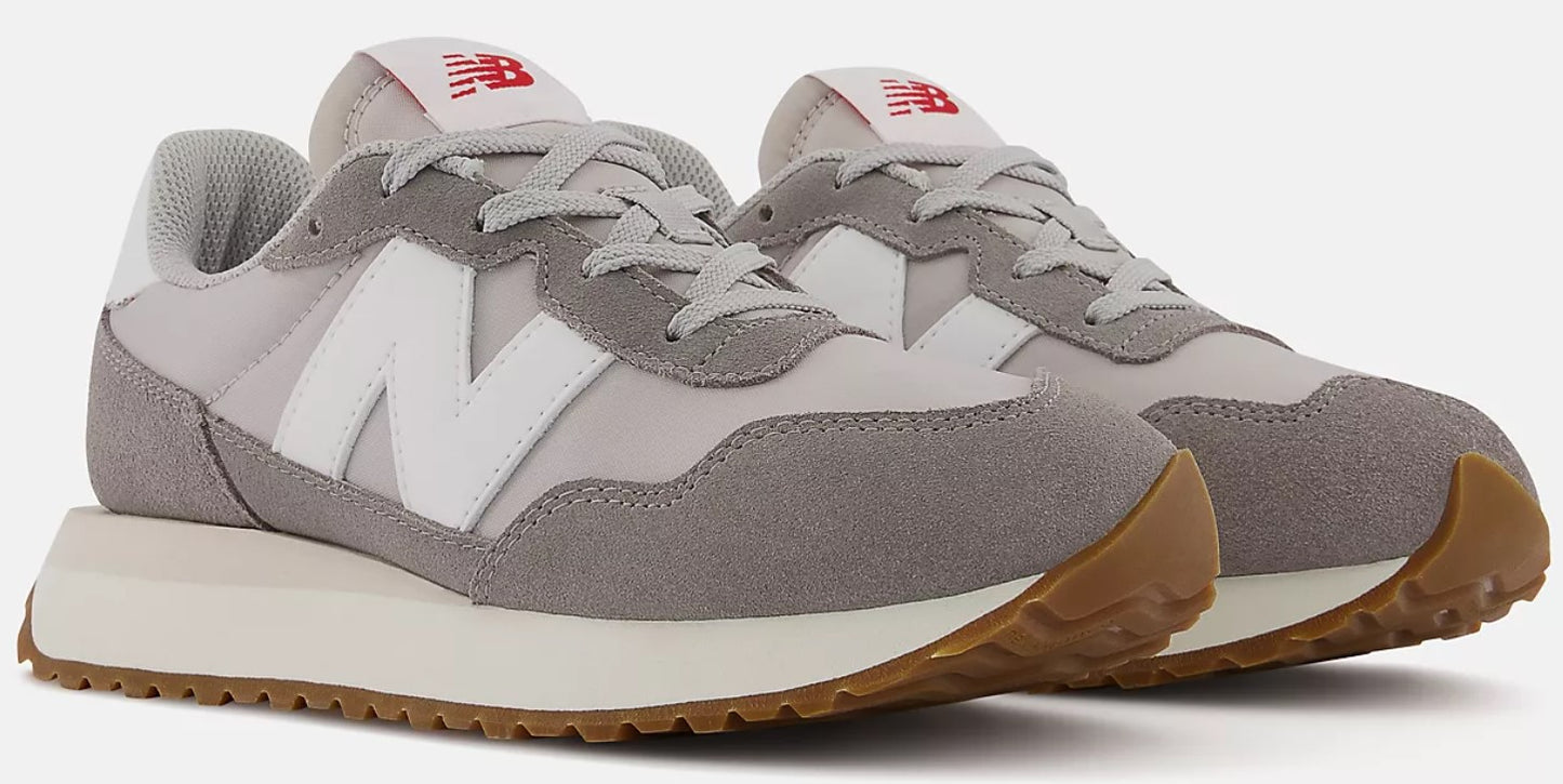 Pair of gray sneakers with white 'N' logo and gum soles