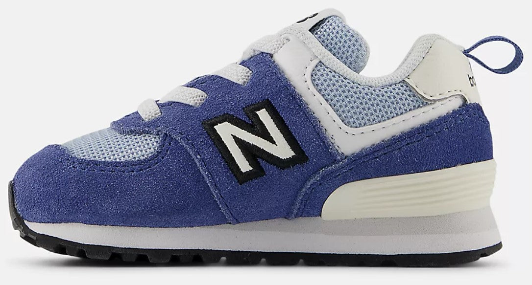 A blue and white toddler shoe with a large 'N' logo on the side.
