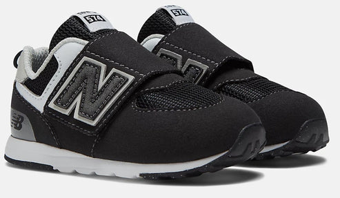 Toddler black shoes with velcro straps, white soles and gray 'N' logo.
