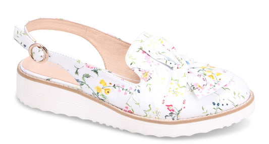 Floral-patterned slingback loafer with white platform sole.