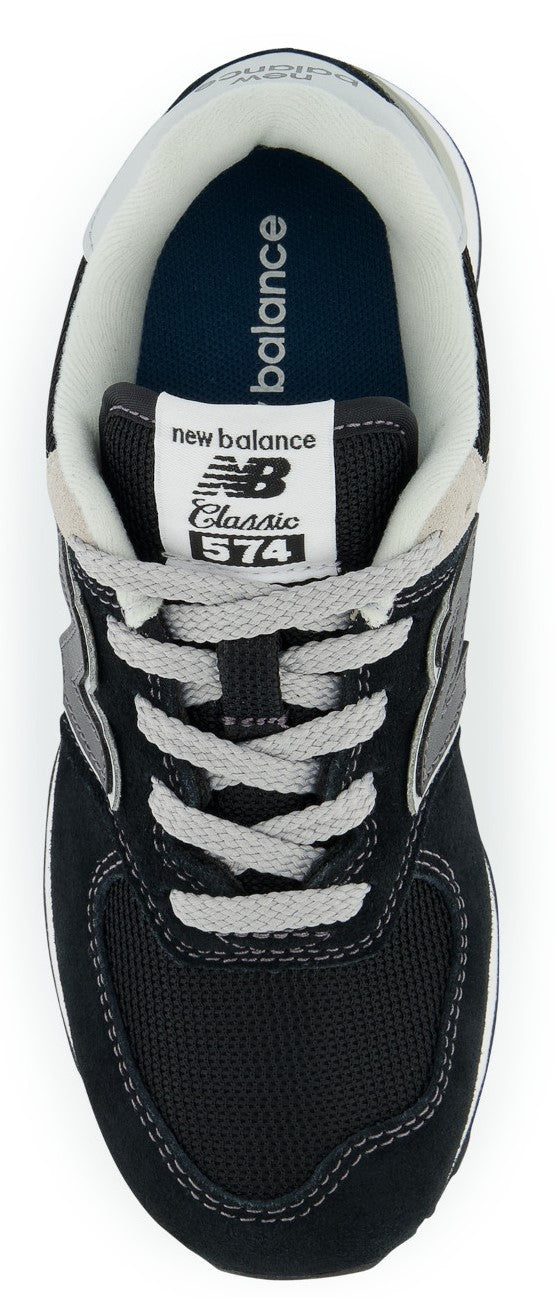 Overhead view of a dark New Balance 574 sneaker with gray laces and a gray and white interior.