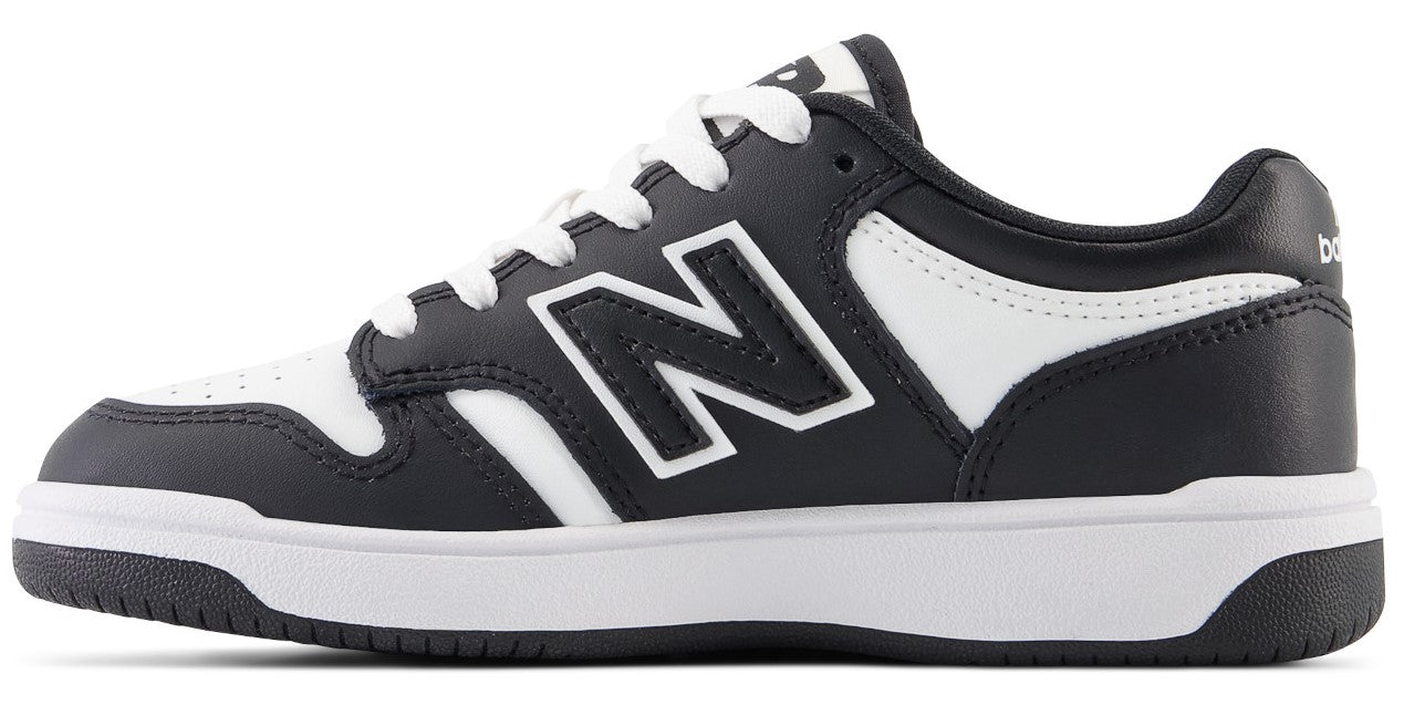 Black and white low-top sneaker with a large 'N' on the side.