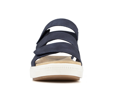 Front view of a navy blue sandal with three hook-and-loop straps and a white platform sole.