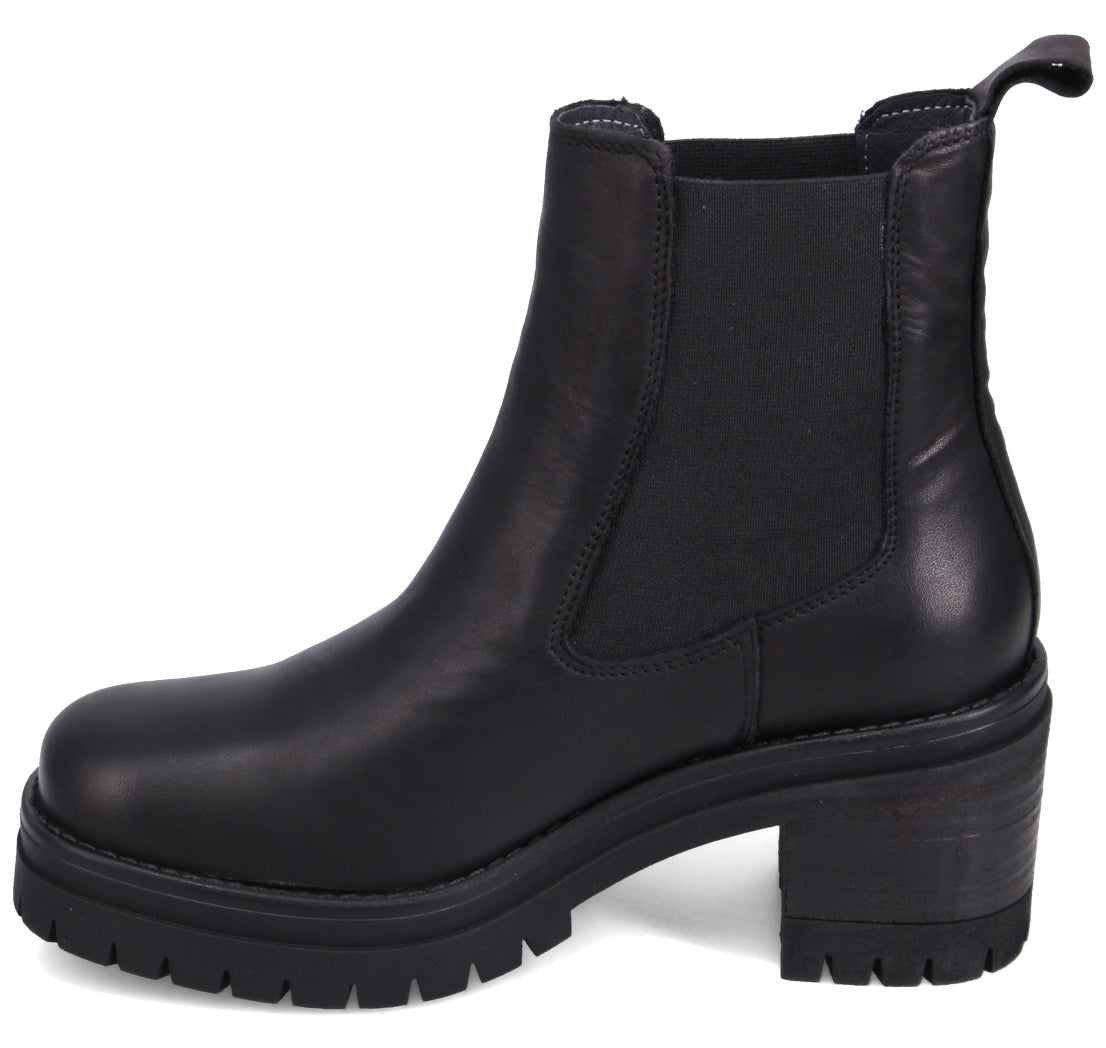 Black leather Chelsea boot with a thick lug sole and block heel.