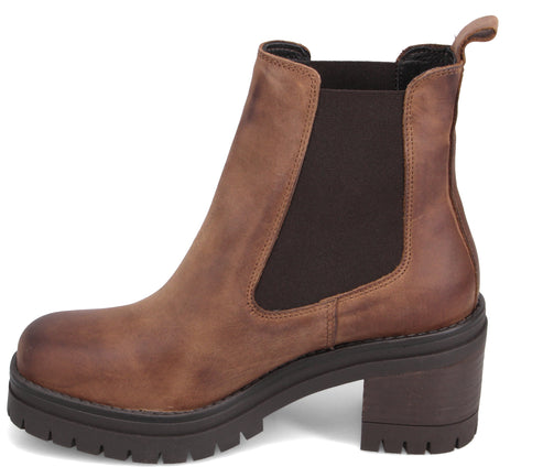Brown leather Chelsea boot with thick lug sole and block heel.