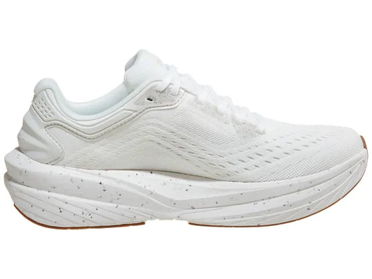 All-white running shoe with thick speckled midsole and textured upper.