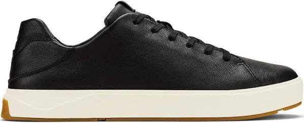 A black leather sneaker with a white sole.