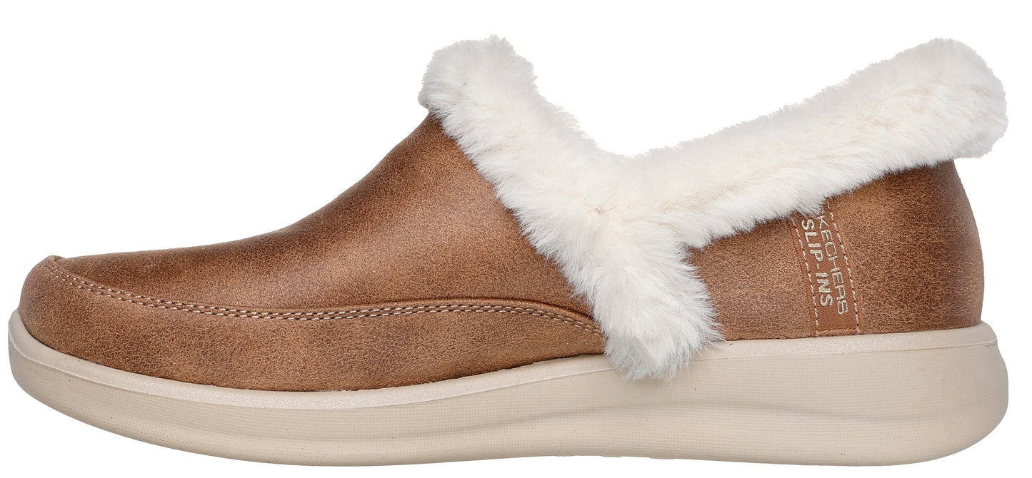 A light brown shoe with faux fur trim.
