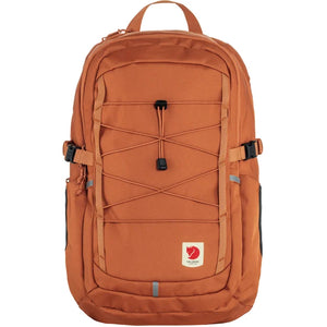 Orange backpack with a bungee cord design on the front.