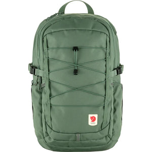 A green backpack with black cord accents.