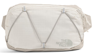 Bone white waist bag with bungee cord front detail and 'THE NORTH FACE' logo.