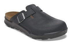 Black clog-style shoe with buckled strap.