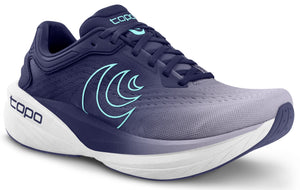Running shoe with a fade from light gray to dark blue, white sole, light blue accents, and 'topo' text near the heel.