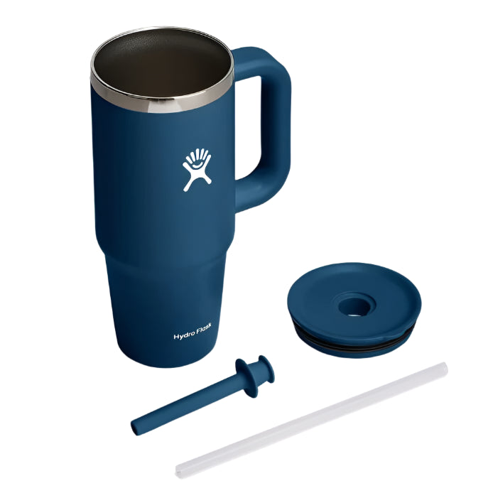 Insulated blue mug with handle, lid, straw, and plug.