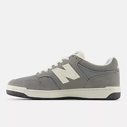 Gray low-top sneaker with white laces and a white "N" logo on the side.