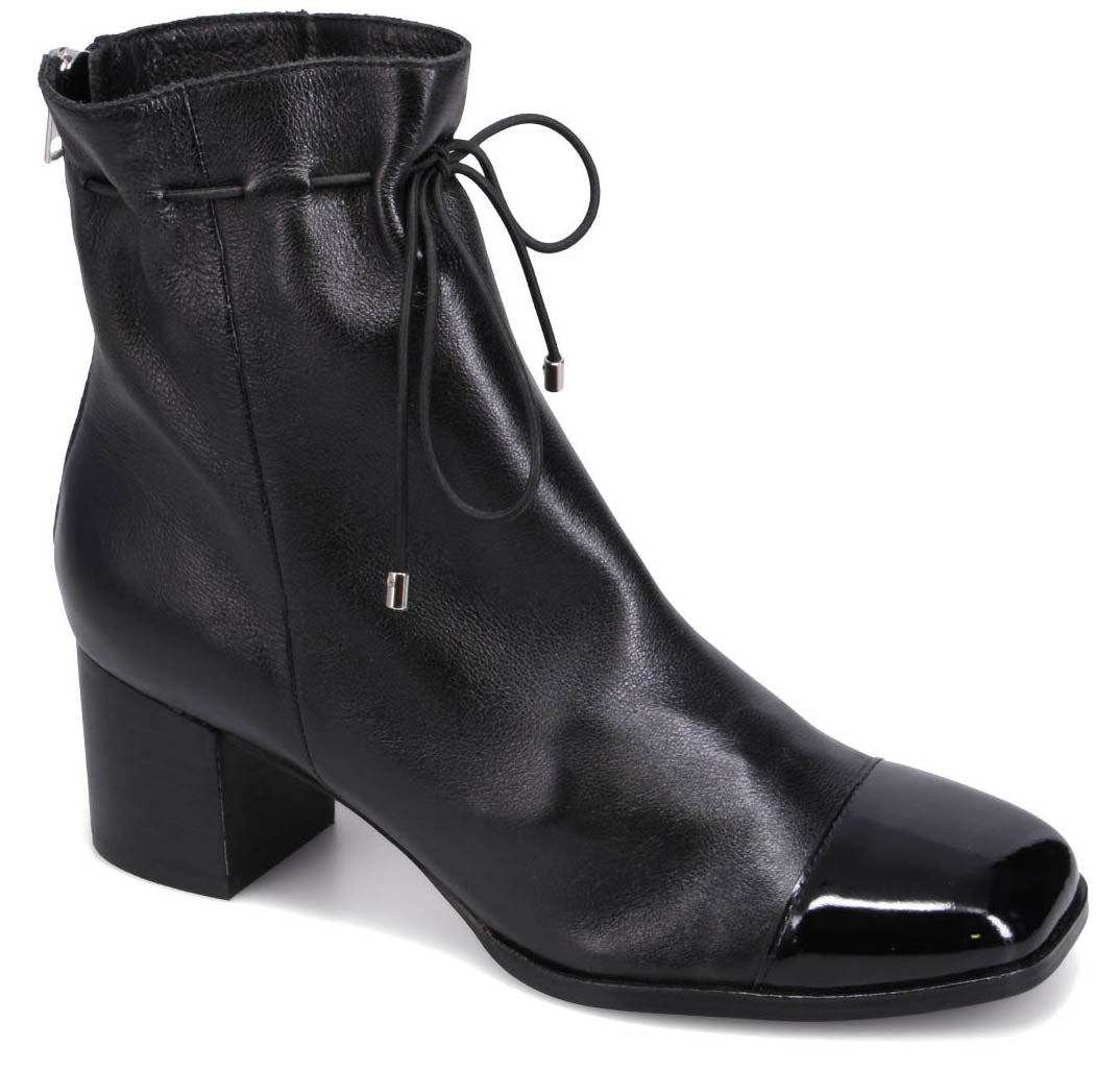 Black ankle boot with a square, patent-leather toe, gathered topline, and block heel.