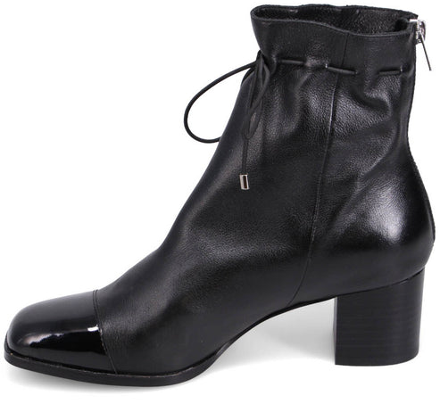 Black ankle boot with a square, shiny toe, a block heel, and a gathered ankle with a drawstring.