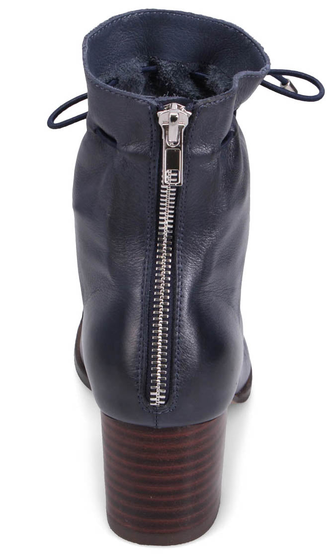 Back view of navy blue leather bootie with a silver back zipper and a stacked block heel.