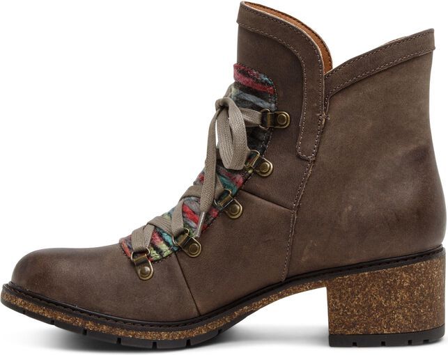 Side view of brown leather ankle boot with a chunky cork heel, lace-up closure with colorful fabric detail, and a textured sole.