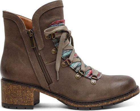 Ankle-high brown leather boot with a block heel, side zipper, and decorative laces over a colorful textile.