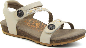 Beige sandal with braided straps and decorative metallic buttons.