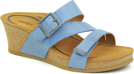 Light blue slide sandal with wedge heel and adjustable buckle strap.