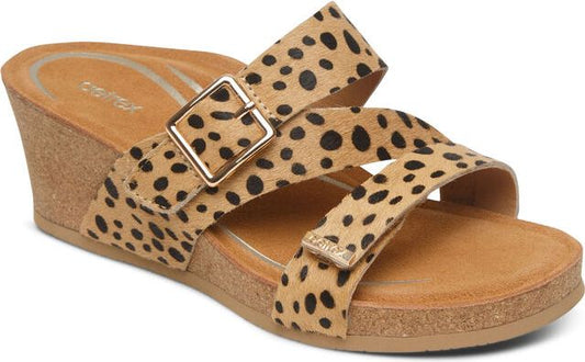 Wedge sandal with leopard print straps and gold buckle.