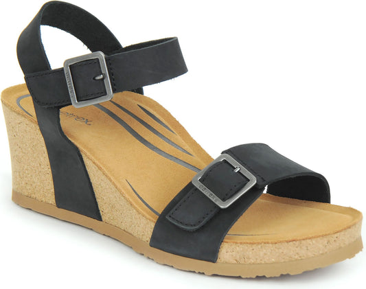 Black sandal with buckle straps and a cork wedge.