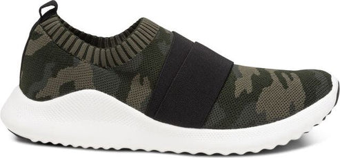 A camouflage slip-on sneaker with a thick black strap and a white sole.