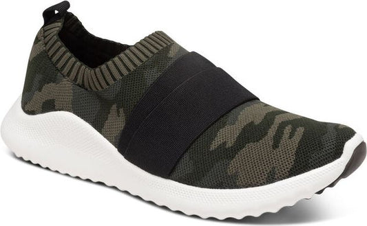 Slip-on camo print sneaker with a black strap and a white sole.