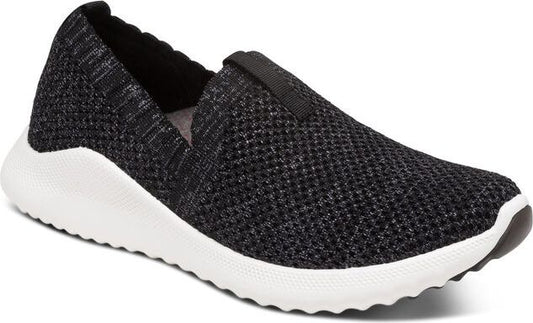Black knit slip-on shoe with white sole.