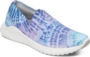 Slip-on sneaker with white sole and abstract blue and purple pattern.