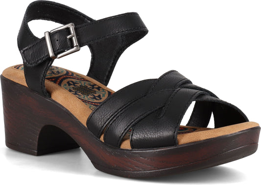 Black sandal with criss-cross straps and ankle strap with buckle on a chunky, wooden block heel.