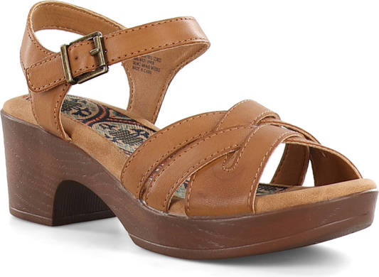 A tan sandal with criss-cross straps, a buckled ankle strap, and a block heel.