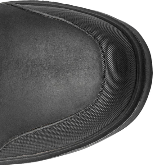 Toe of a black, textured boot.