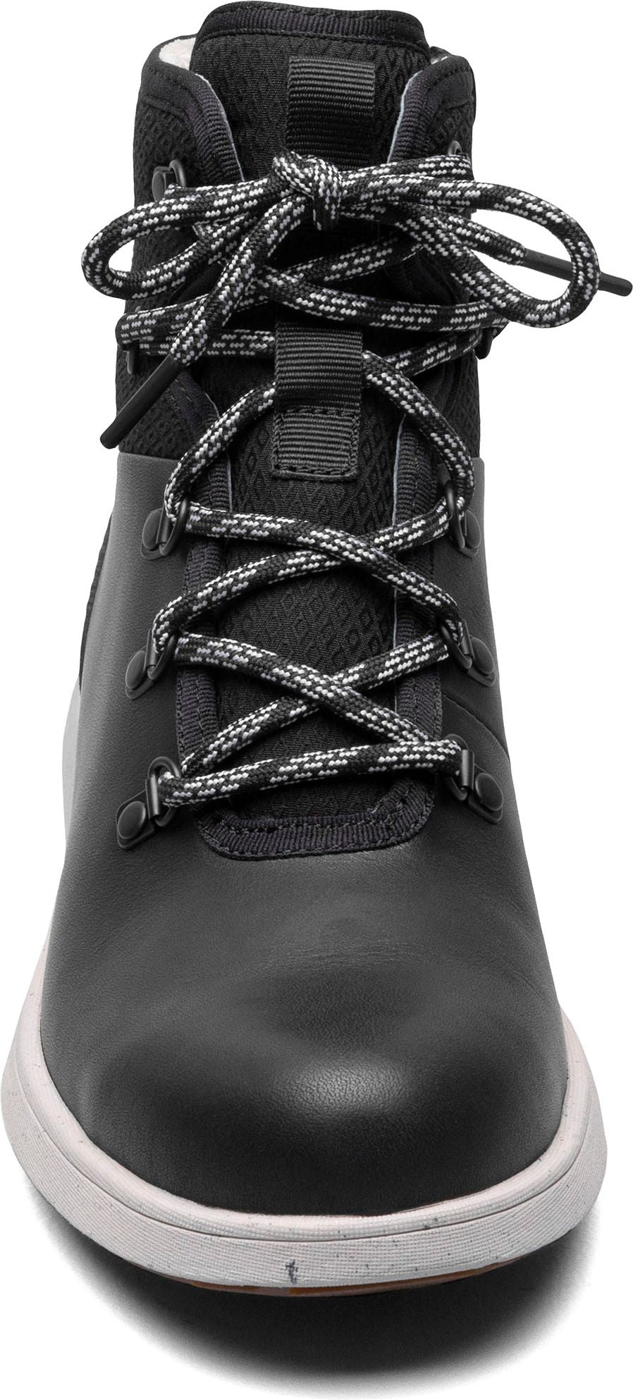 A black boot with white speckled laces and a white sole.