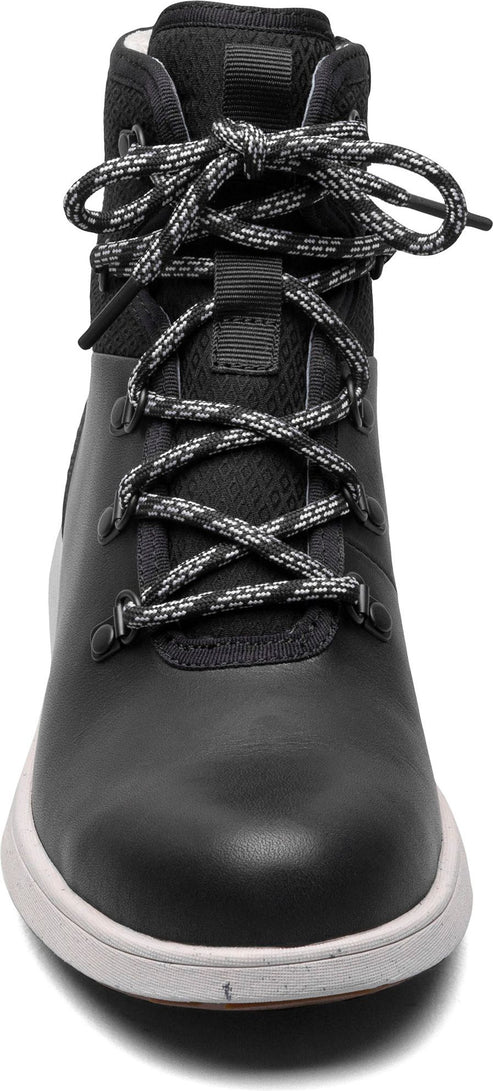 A black boot with white speckled laces and a white sole.