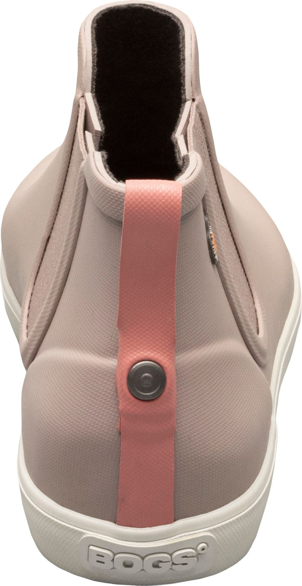A light pink ankle boot with a white sole and a pink pull tab with a button.