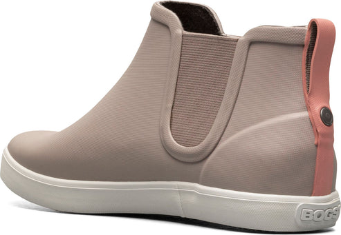 Side view of taupe ankle boot with pink pull tab and white sole.
