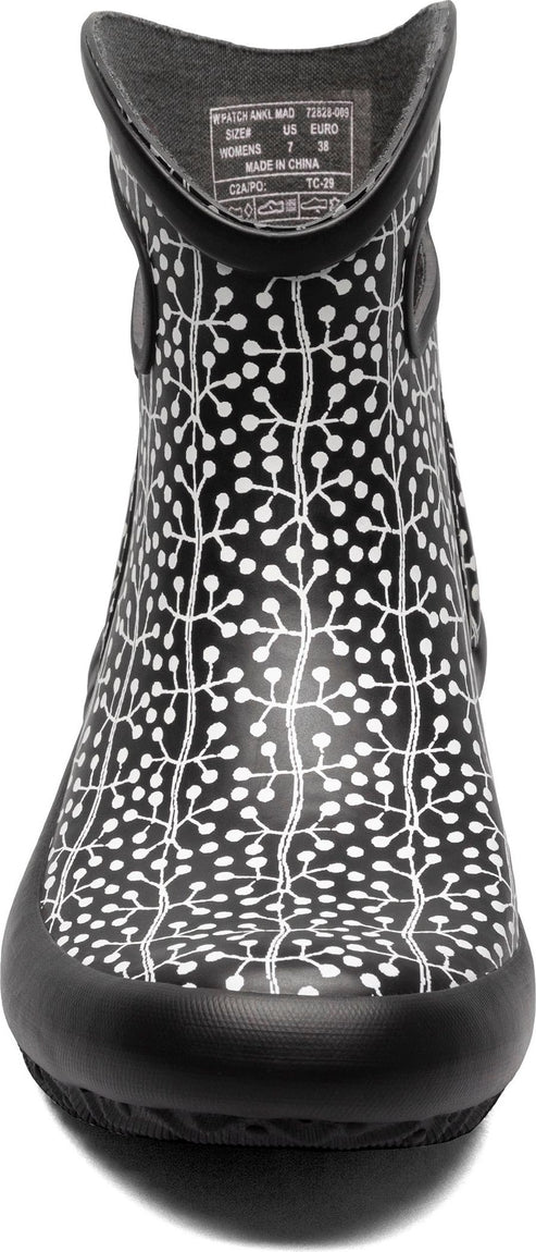 A black short boot with a white botanical print.
