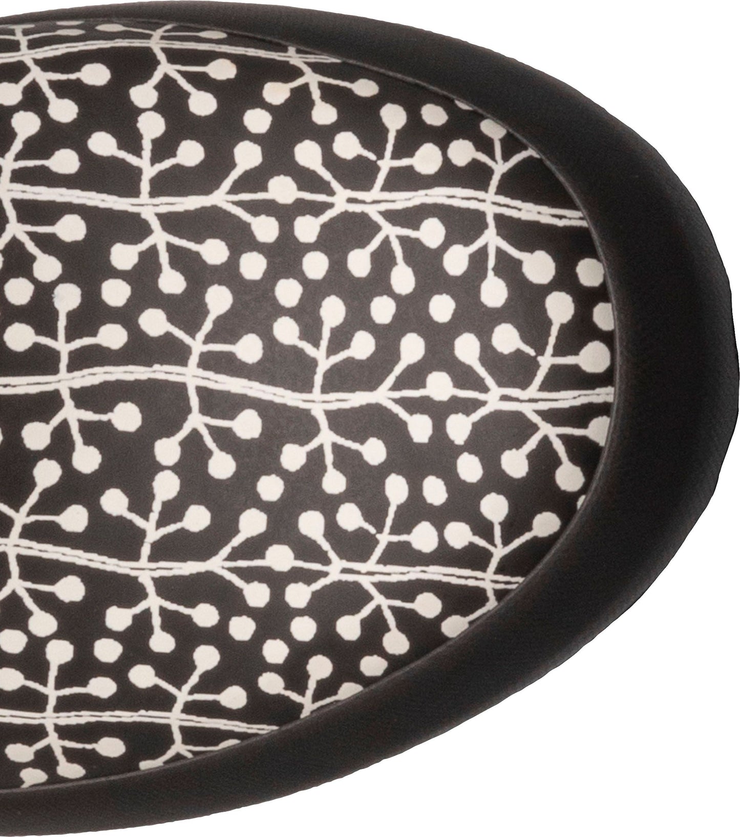 Close-up of a black and white patterned oval sole.