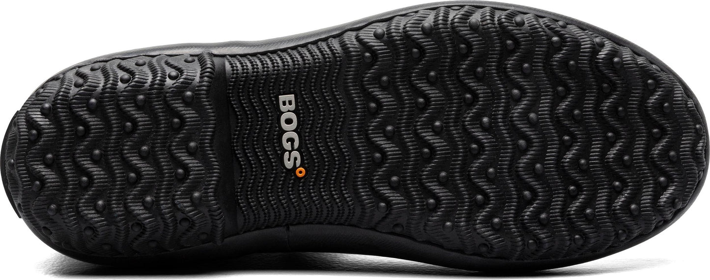 The black sole of a shoe has a wave-like tread pattern with small bumps for grip and the word 'BOGS' on the side.