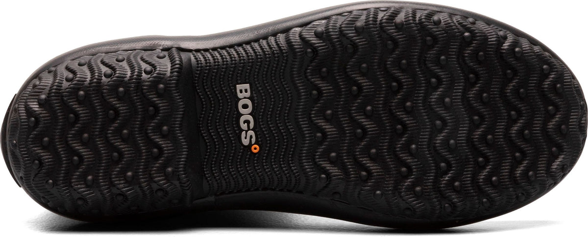 Close up of a dark shoe sole featuring a patterned tread design and the Bogs logo.