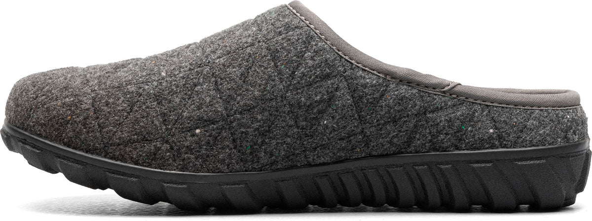 A grey quilted-fabric slip-on shoe with a black sole.