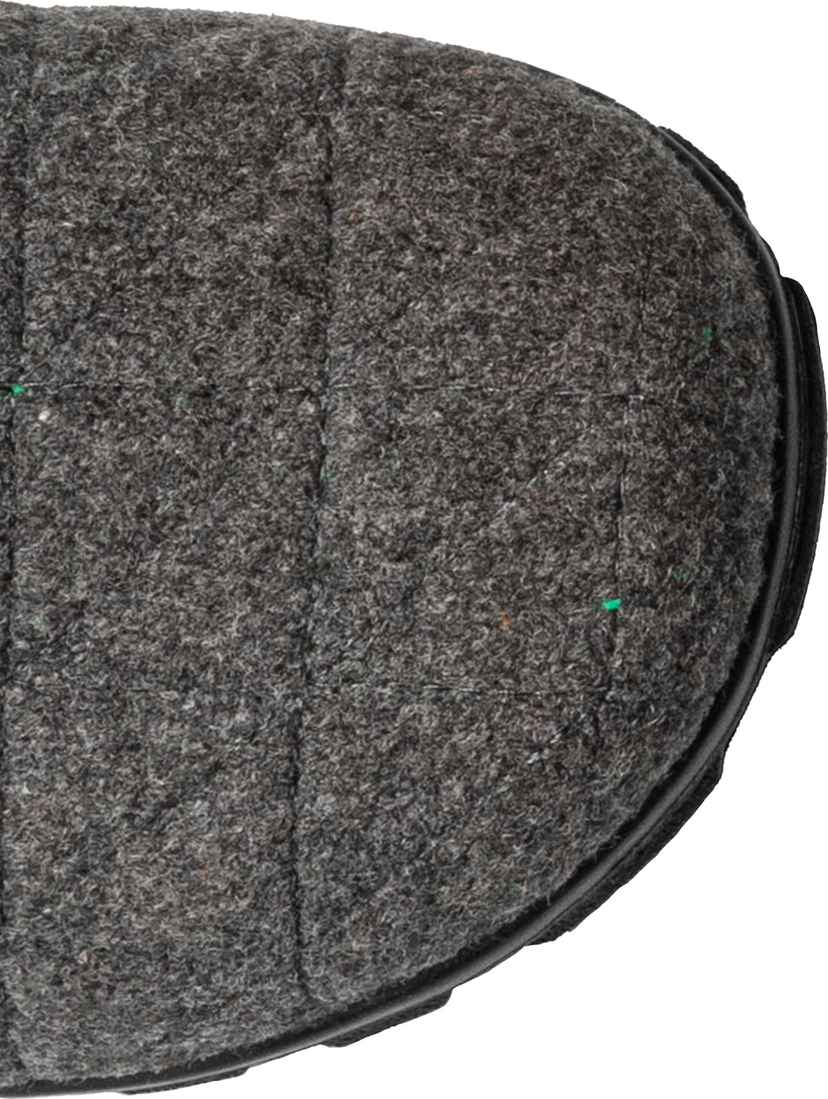 Close-up of gray, felt boot toe with black sole.